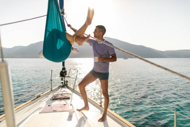 istock Young couple on sailboat 1980087864