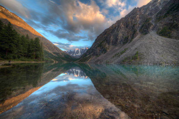 istock Mountain peaks are illuminated by the evening sun. 1980087892