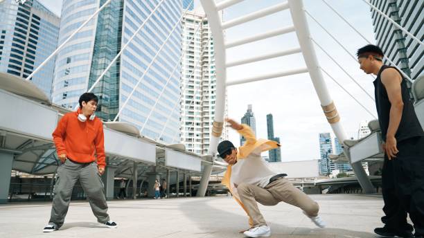 istock Group of street dancer cheer up while hipster perform b boy dance. Sprightly. 1980095755