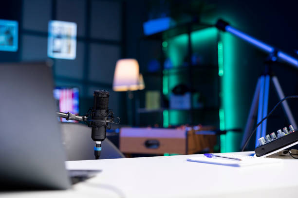 istock Close up of professional microphone in empty studio 1980101805