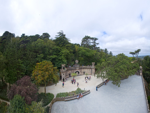 Aerial view of some tourists that are visiting Quinta da Regaleira (Sintra - Portugal).
Quinta da Regaleira is a quinta located near the historic centre of Sintra, Portugal. It is classified as a World Heritage Site by UNESCO within the 