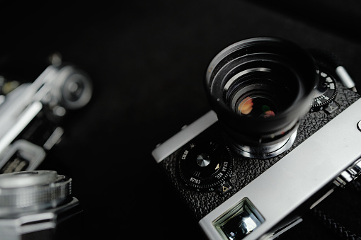 A close-up view showcasing three classic film cameras produced half a century ago, capturing the vintage charm of photography technology.