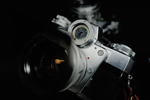 A close-up view showcasing three classic film cameras produced half a century ago, capturing the vintage charm of photography technology.