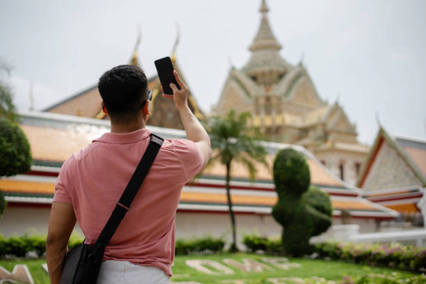 istock man taking selfie when  Exploring The Grand Palace in Bangkok 1980115433