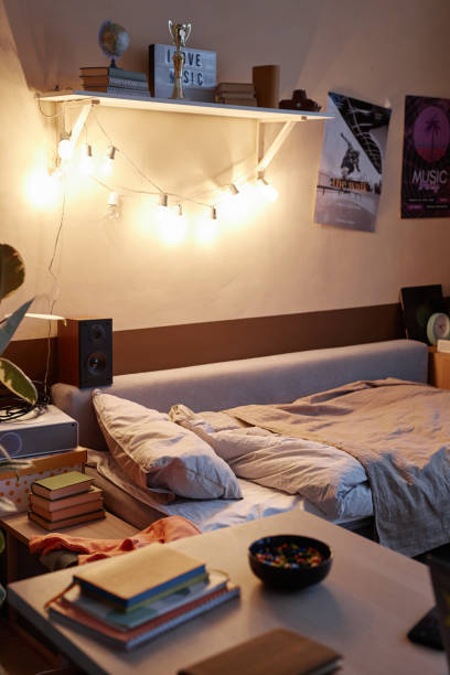 istock Teen Bedroom Interior with Posters on Wall 1980152091