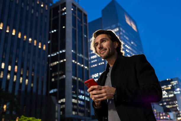 istock View of young man using a smartphone at night 1980154806