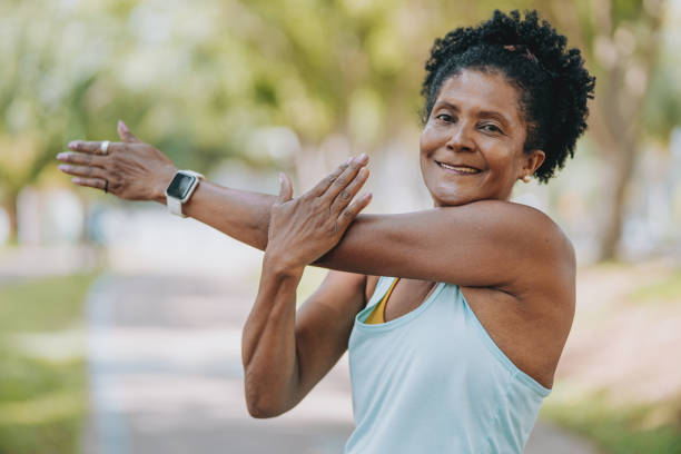 istock Mature woman stretching 1980165597