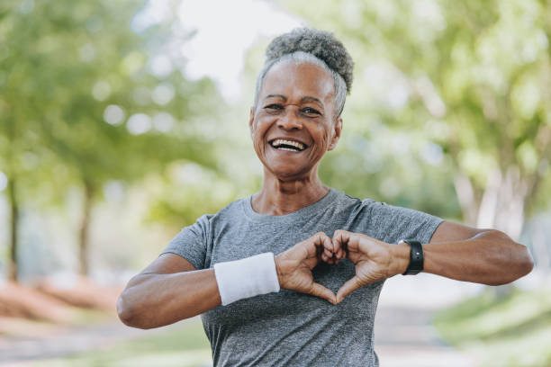 istock Senior woman heart symbol 1980167174