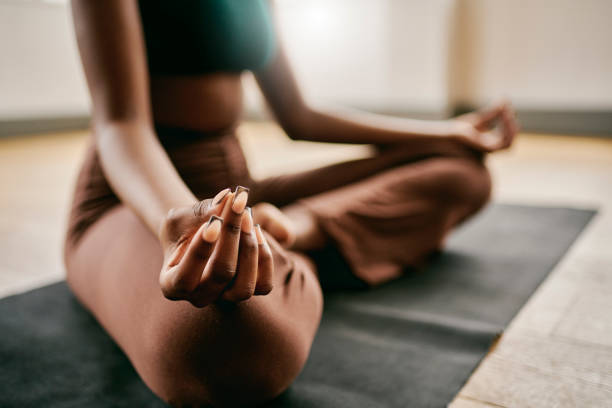 istock Tranquility Within: Woman Finding Inner Peace in a Serene Yoga Studio 1980180427