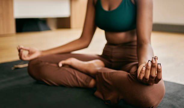 istock Tranquility Within: Woman Finding Inner Peace in a Serene Yoga Studio 1980180438