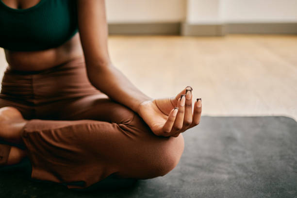 istock Tranquility Within: Woman Finding Inner Peace in a Serene Yoga Studio 1980180447