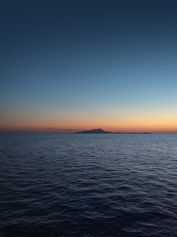 Spectacular sunset on the islands of Procida and Ischia seen from the sea
