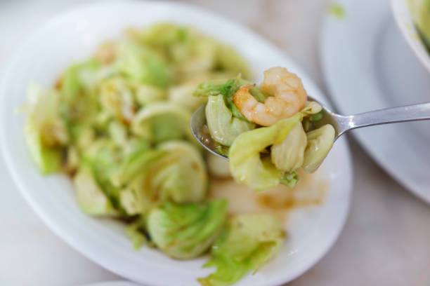 Stir-fried vegetables with prawns and soy sauce, a Thai cuisine dish.