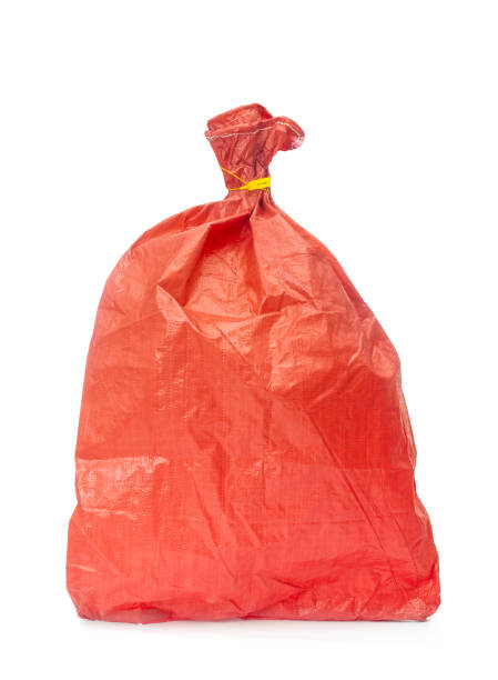 istock Red plastic sack close up on a white background 1980219469