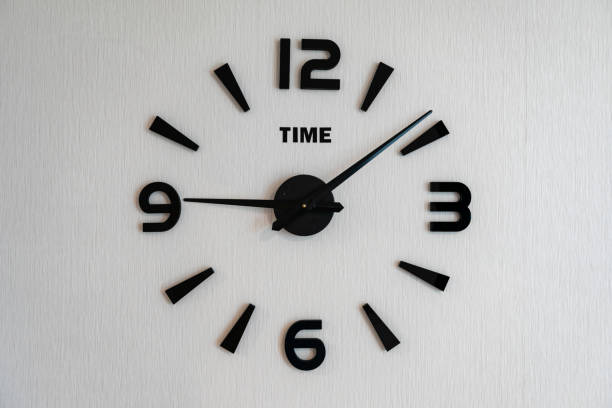 istock modern clock on an entire wall in the house 1980221045
