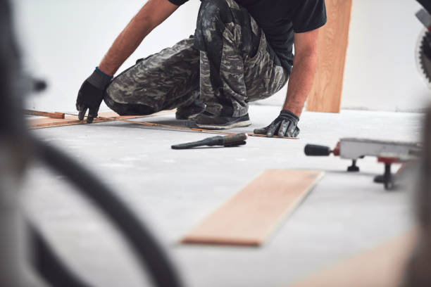 istock Professional handyman installing laminate flooring in a new apartment. 1980232716