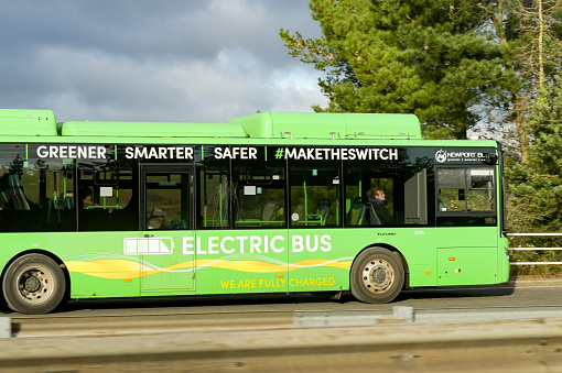 Newport, Wales, UK - 10 January 2024: Electric bus operated by Newport Bus travelling on a road near the city centre.