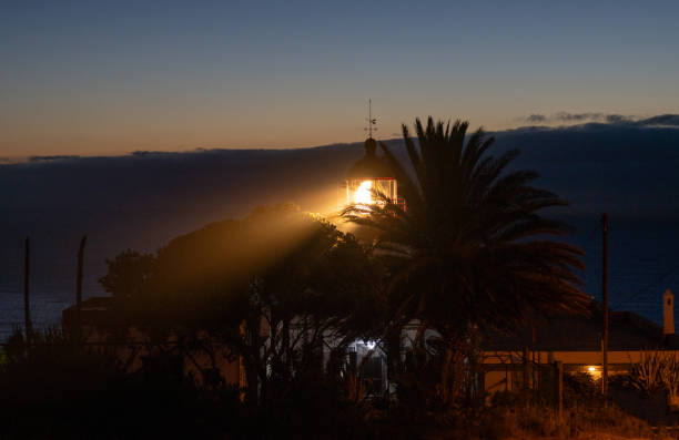Lighthouse building on the island of Madeira in Portugal. Guiding the ships on the sea to safely return to harbor