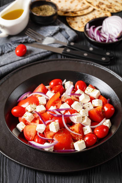 istock tomato salad with red onion and white cheese 1980280590