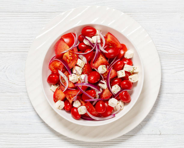 istock tomato salad with red onion and white cheese 1980280593