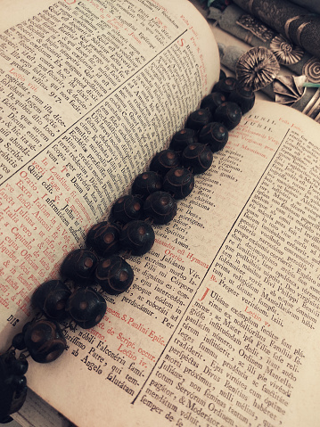 Tibetan necklace in an old sacred prayer text