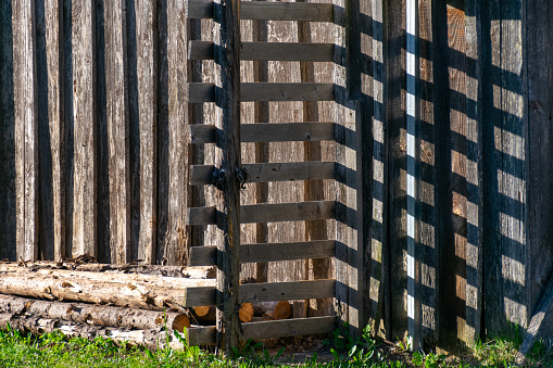 abstract shadow play from the wooden fence, interesting checkered texture, rhythm