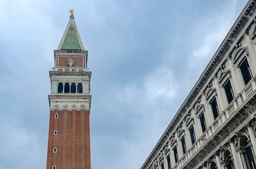 Glimpse of Piazza San Marco with the historic bell tower in Venice, Italy.