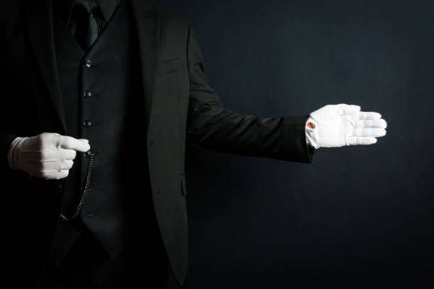 istock Butler With Welcoming Gesture 1980308801