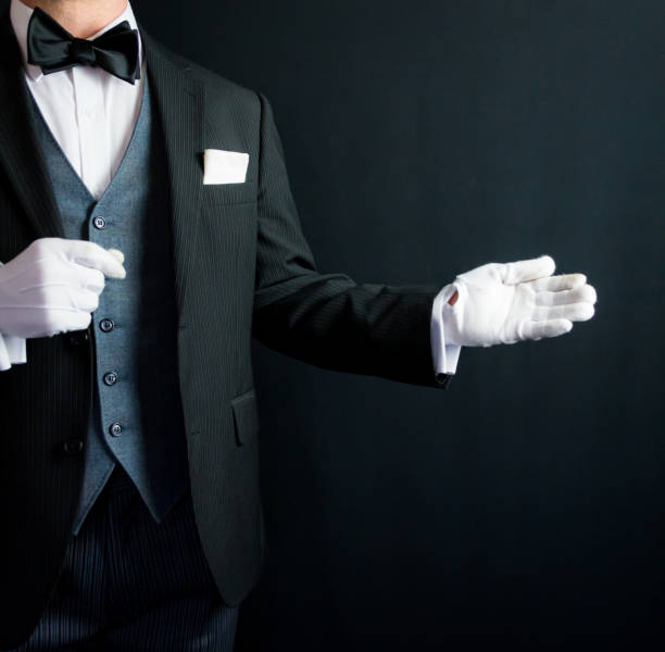 istock Butler or Hotel Concierge With Welcoming Gesture 1980310946