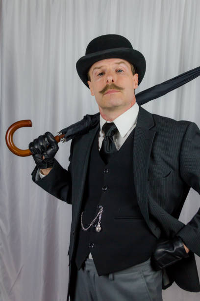 istock British Gentleman With Umbrella in Jaunty Pose 1980312033