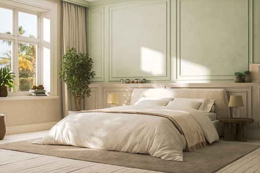 Interior of a modern cozy bedroom with furniture in pastel tones.