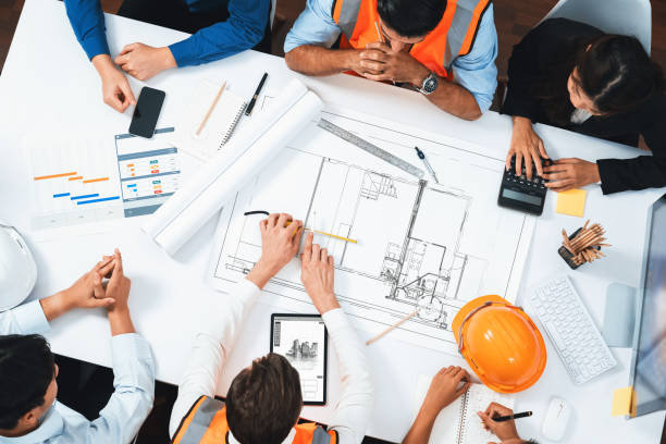 istock Diverse group of civil engineer and client working on architect. Prudent 1980341125