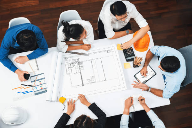 istock Diverse group of civil engineer and client working on architect. Prudent 1980345940