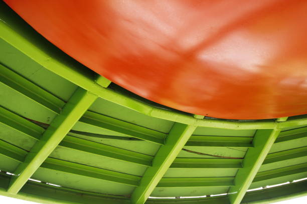 Abstract shape of two fields with orange and light green ones.