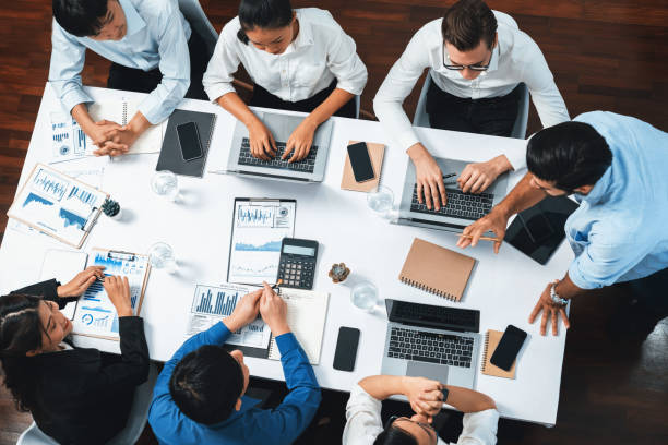 istock Analyst team utilizing BI Fintech to analyze financial data at table. Prudent 1980386268