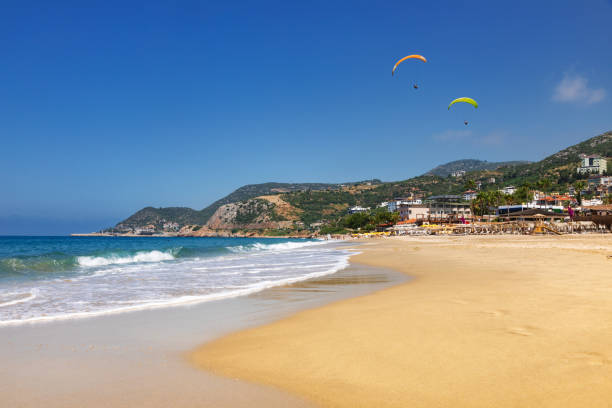 istock Paragliders soaring above Kleopatra Beach Alanya Turkey 1980389469