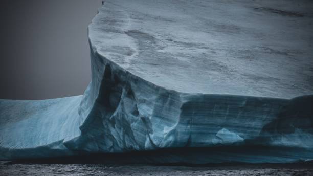 istock Dark Antarctica Giant Iceberg on Antarctic Ocean 1980421992