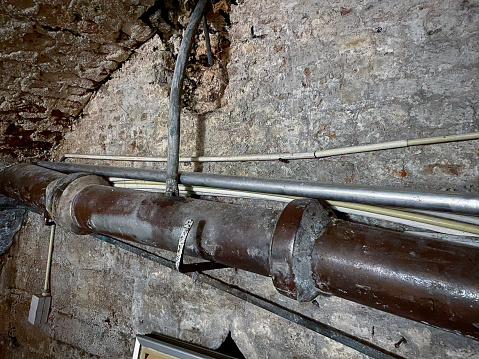 Old  sewage tube in cellar. This is a celler  of an old building in the city of Roermond. The building will be demolished later