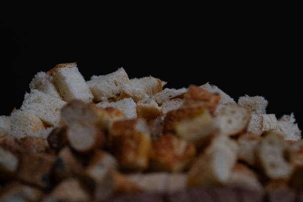 istock pieces of different types bread on black background 1980535958
