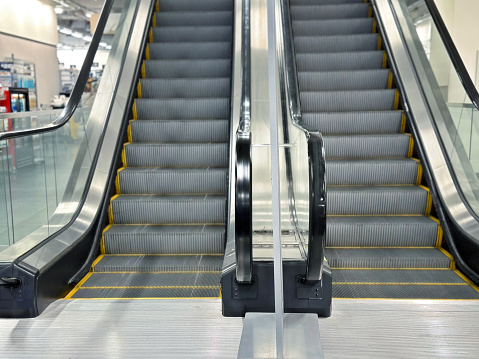 Escalators side by side in a mall
