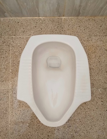 A squat toilet, close up