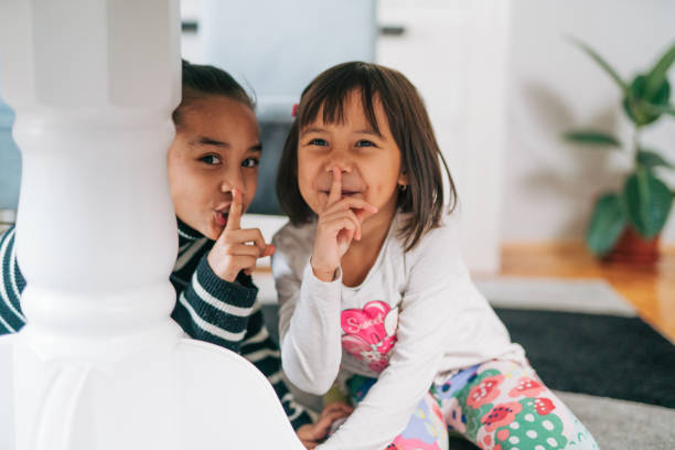 Little Girl Covering Face and Peeking