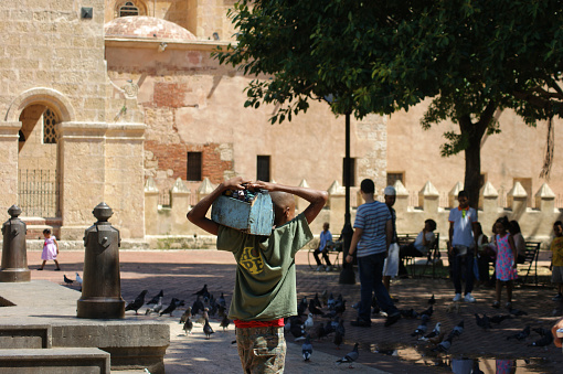 People on the street in Santo Domingo on a hot summer day