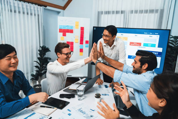 istock Happy office worker achieving business task on time and on schedule. Prudent 1980587255