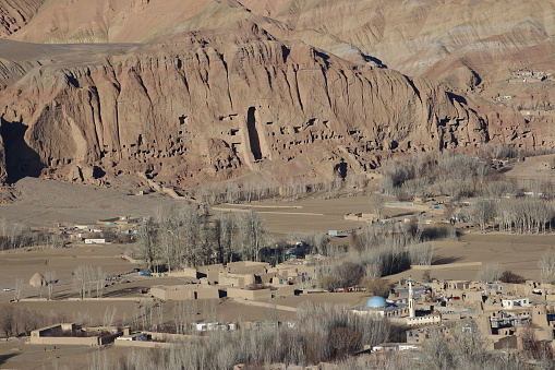 The beautiful view of Bamiyan Valley with majestic rock formations and dry vegetation. Afghanistan