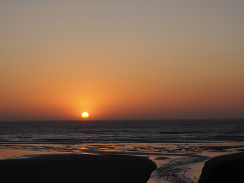Sun going own at Moonstone Beach, Cambria, California.