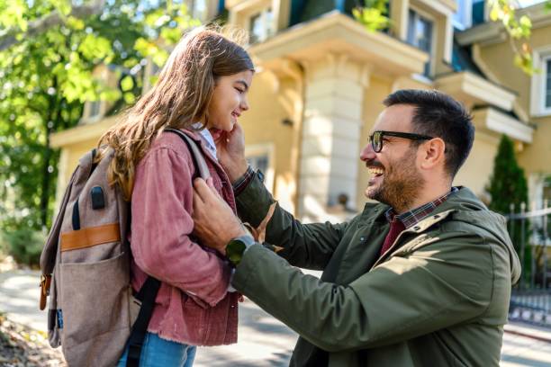 istock Father taking his daughter to school 1980671124