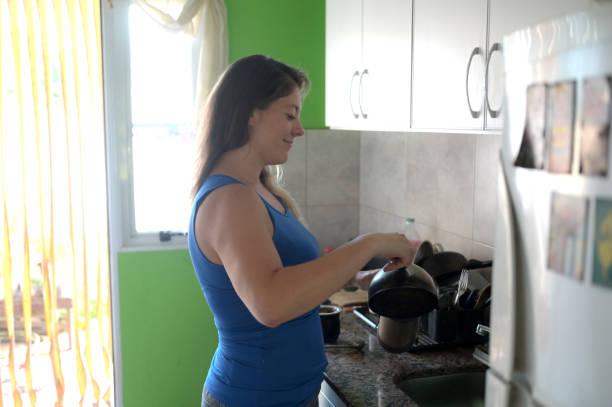 istock woman preparing infusion 1980676293