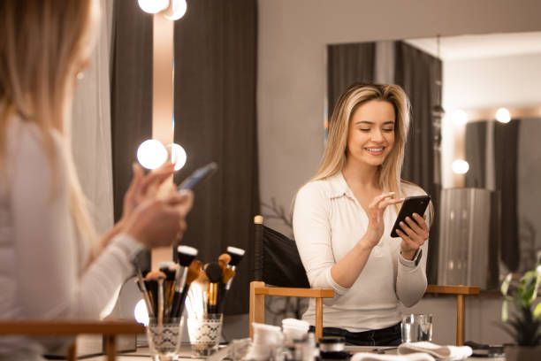istock Makeup Artist Engaging with Client: Smiles and Expertise 1980685163