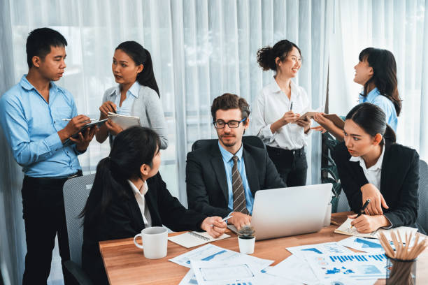 istock Group of business analyst team analyzing financial data report. Habiliment 1980714984